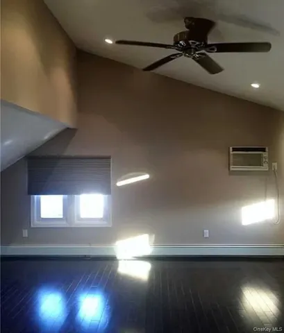 a view of an empty room and a window