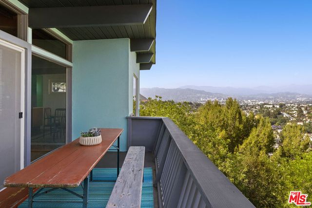 a view of balcony with furniture