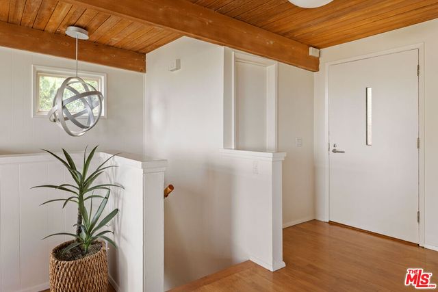 a view of entryway with wooden floor