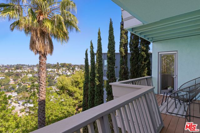 a bathroom with a sink a mirror and shower