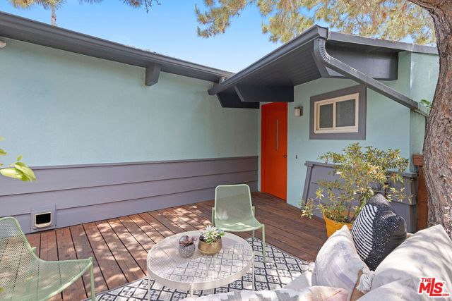 a outdoor living space with furniture and a potted plant