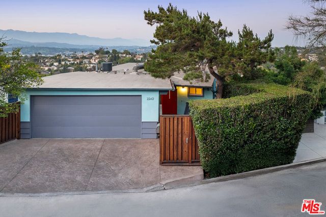 a outdoor living space with furniture and a potted plant