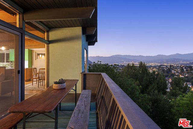 a view of balcony with furniture