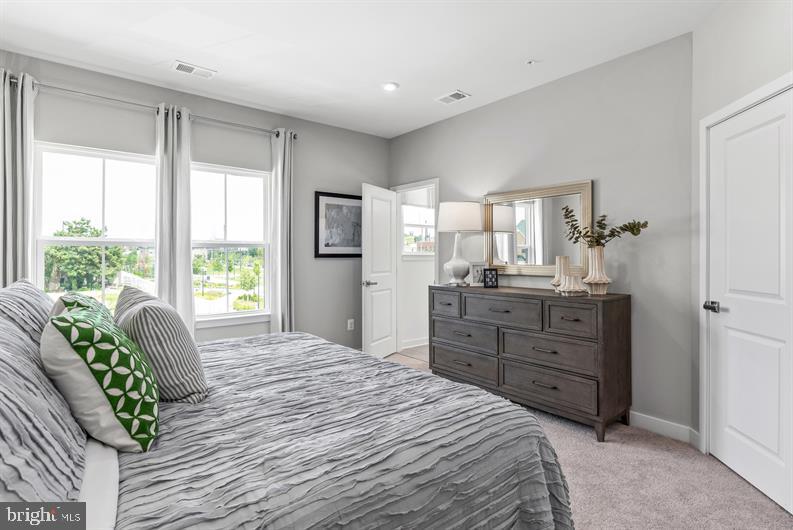 Kloman Street, Unit MOZART 4 Baltimore, MD 21230 - Photo 13 of 27 a bedroom with a bed dresser and a window