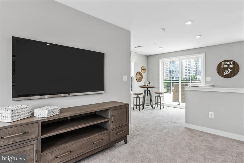 Kloman Street, Unit MOZART 4 Baltimore, MD 21230 - Photo 17 of 27 a living room with furniture and a flat screen tv