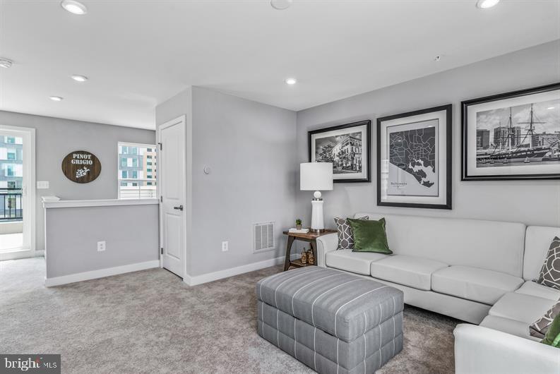 Kloman Street, Unit MOZART 4 Baltimore, MD 21230 - Photo 18 of 27 a living room with furniture and a table