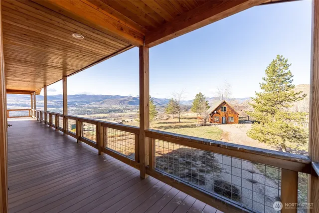 a view of balcony with wooden floor