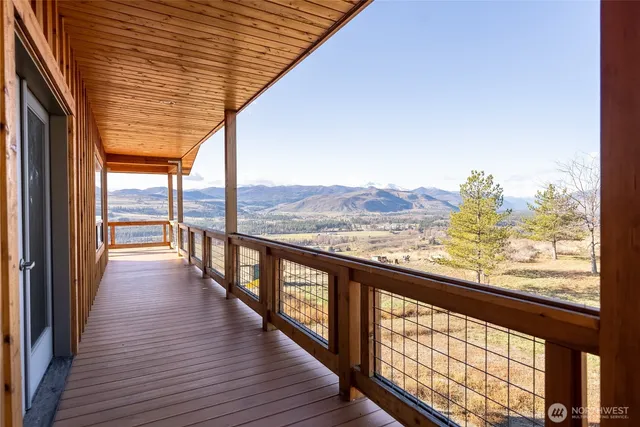 a view of an empty room with windows