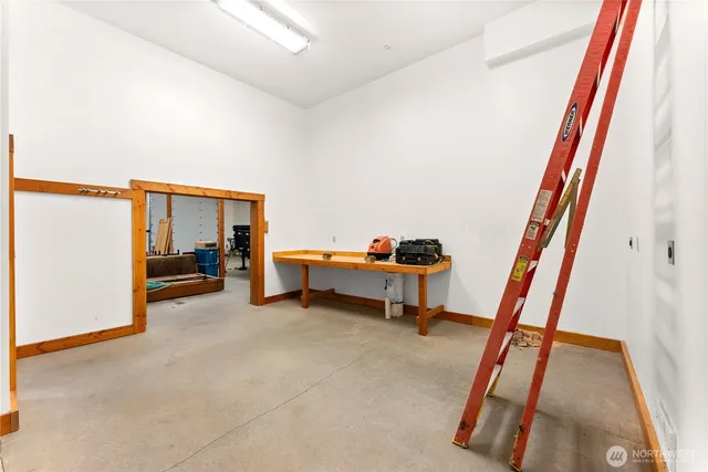 a kitchen with stainless steel appliances kitchen island granite countertop a refrigerator and a stove