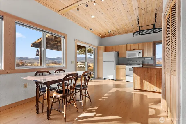 a room with a table chairs and a dining table