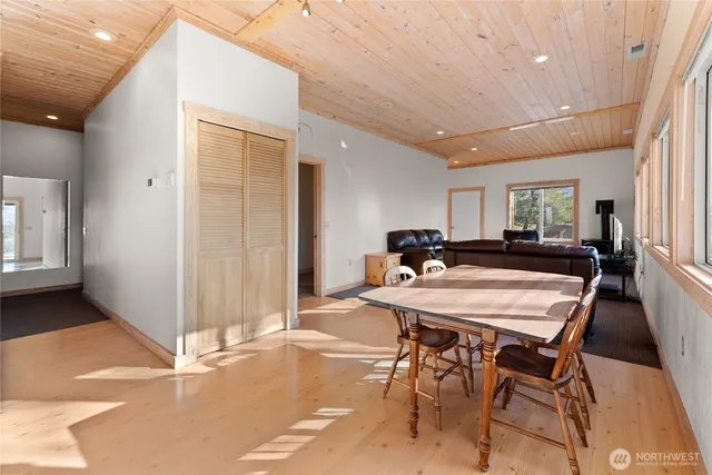 a living room with furniture and large windows
