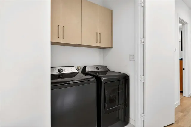 a utility room with dryer and washer