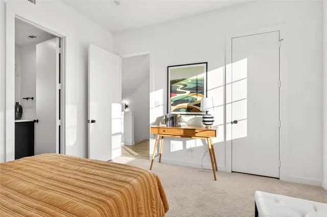 a bedroom with a bed and a table in it