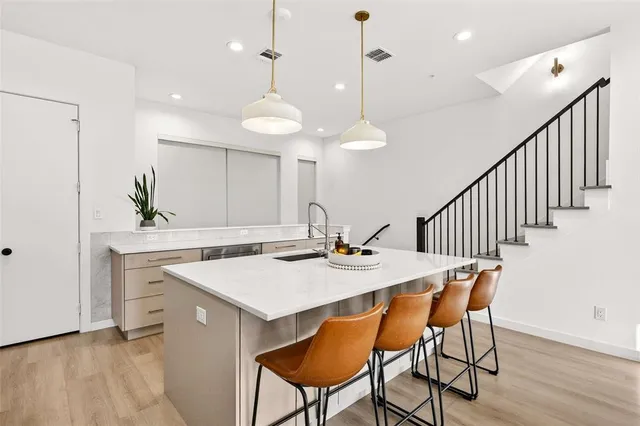 a view of a a dining room and hall with furniture
