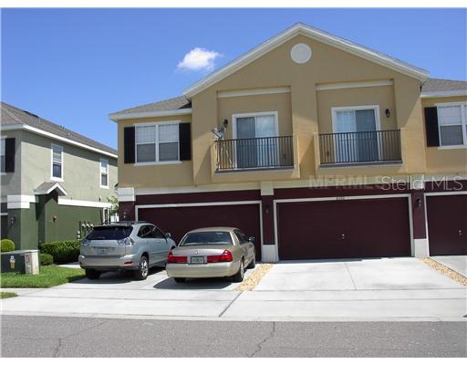 6592 South Goldenrod Road, Unit 94C Orlando, FL 32822 - Photo 1 of 1 a front view of a house with a parking space