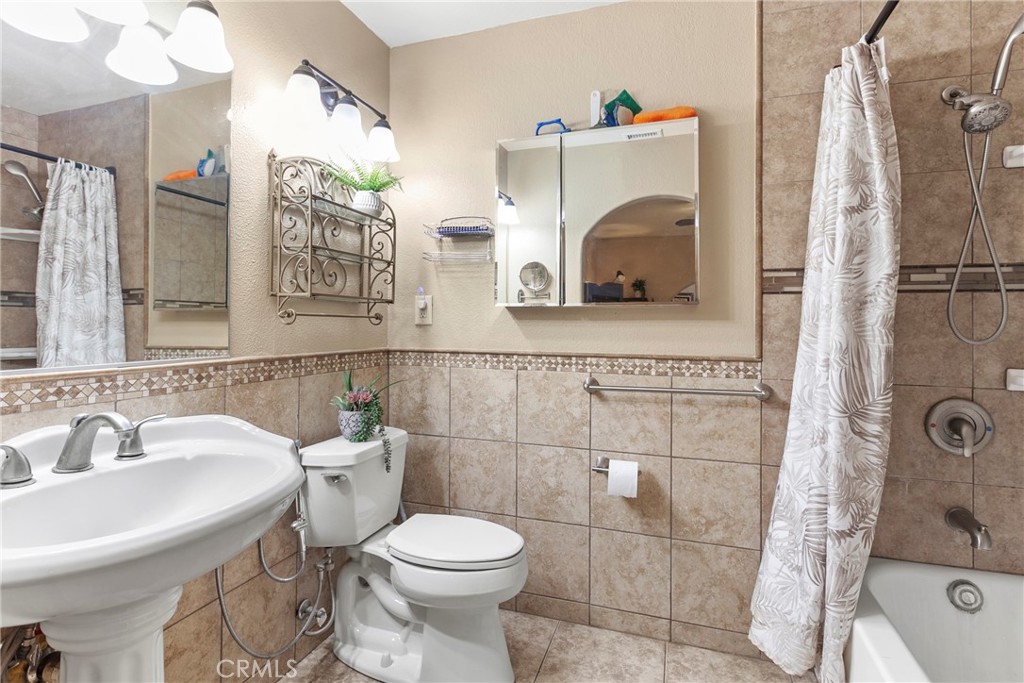 245 Walnut Street Arroyo Grande, CA 93420 - Photo 15 of 34 a bathroom with a sink a toilet and shower