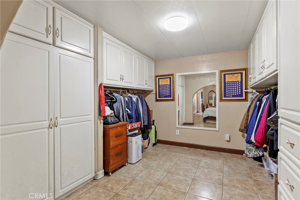 245 Walnut Street Arroyo Grande, CA 93420 - Photo 17 of 34 a view of walk in closet with clothes and shoes