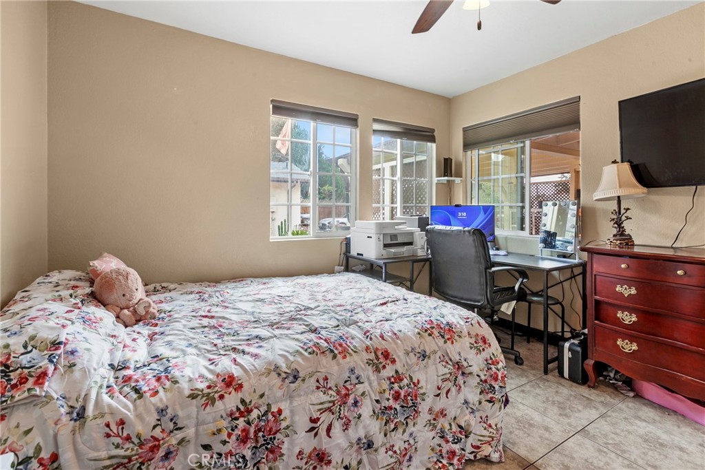 245 Walnut Street Arroyo Grande, CA 93420 - Photo 20 of 34 a bed room with a bed and a flat tv screen