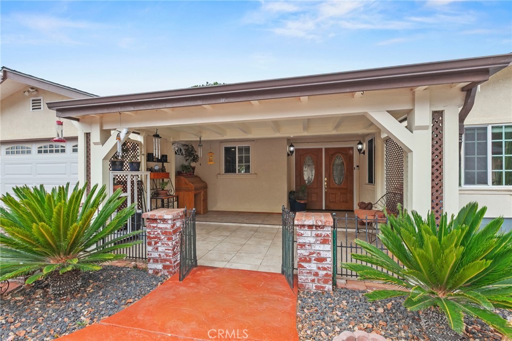 245 Walnut Street Arroyo Grande, CA 93420 - Photo 2 of 34 a view of a porch with potted plants