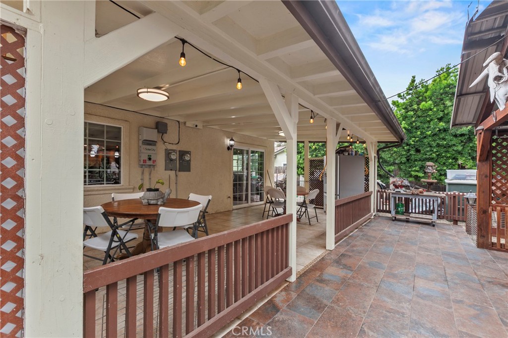 245 Walnut Street Arroyo Grande, CA 93420 - Photo 21 of 34 a view of a patio with a table and chairs and potted plants