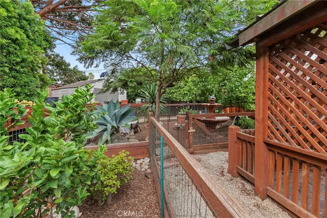 a view of a balcony with wooden fence and floor