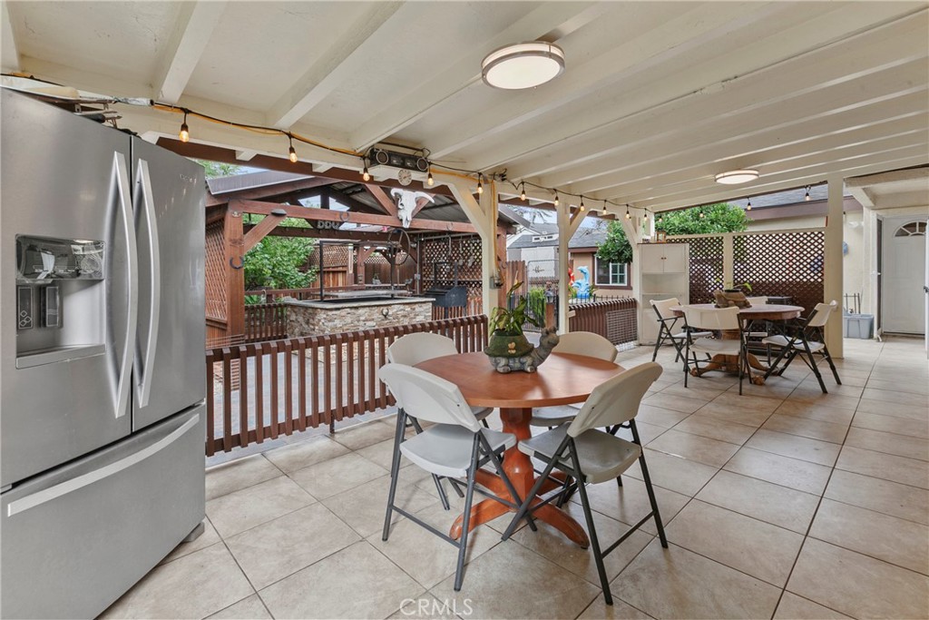 245 Walnut Street Arroyo Grande, CA 93420 - Photo 26 of 34 a view of a patio with a table and chairs