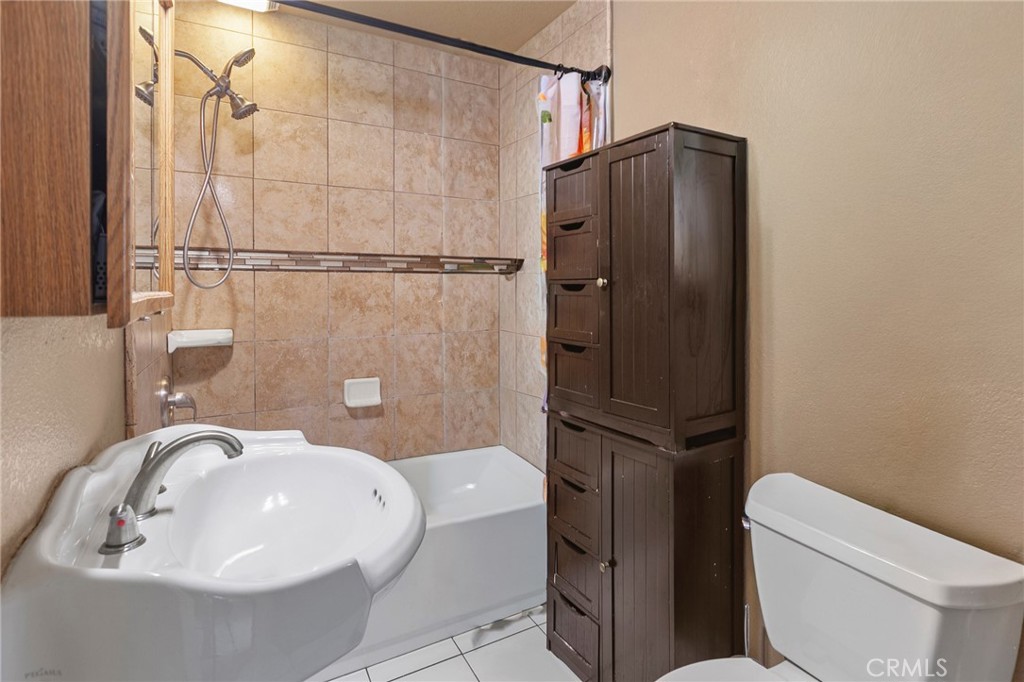 245 Walnut Street Arroyo Grande, CA 93420 - Photo 30 of 34 a bathroom with a sink toilet and shower