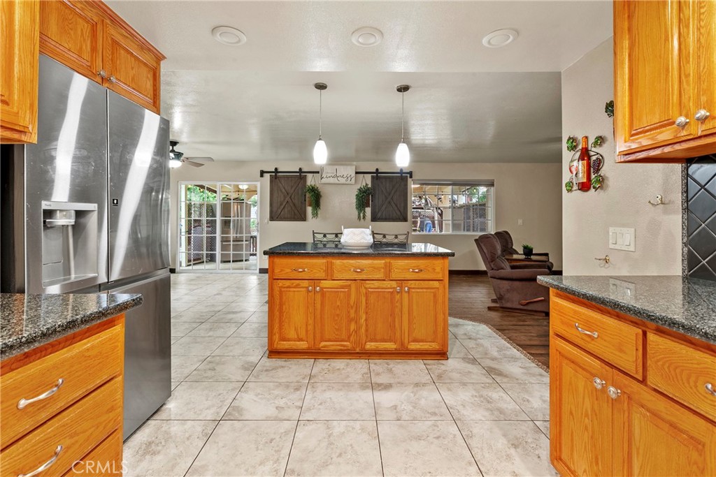 245 Walnut Street Arroyo Grande, CA 93420 - Photo 10 of 34 a kitchen with stainless steel appliances granite countertop a stove a sink and a refrigerator