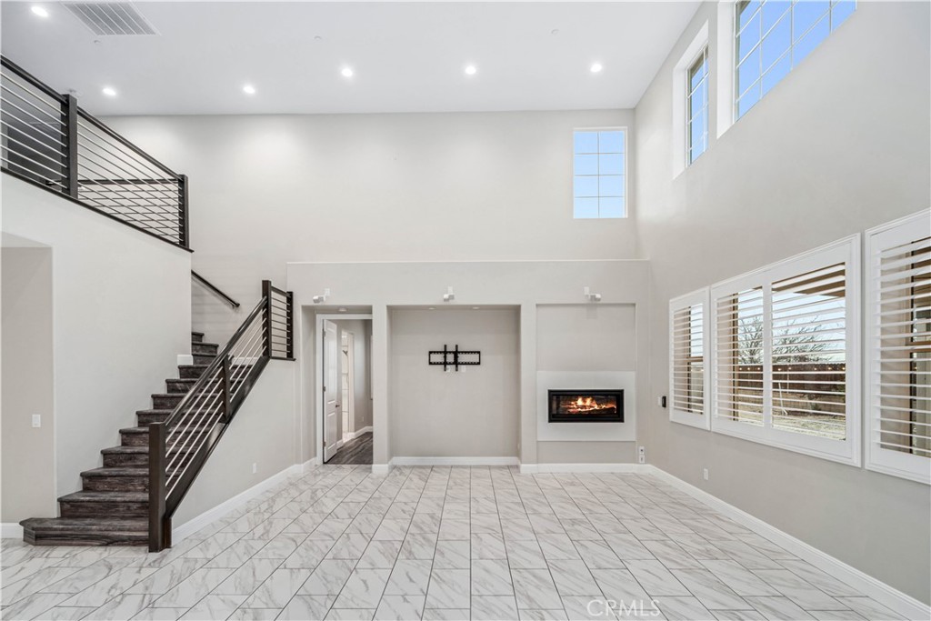 41908 Sonoma Road Palmdale, CA 93551 - Photo 12 of 75 a view of a livingroom with wooden floor and a window