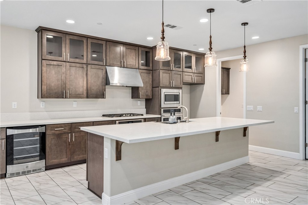 41908 Sonoma Road Palmdale, CA 93551 - Photo 16 of 75 a kitchen with stainless steel appliances granite countertop a sink a stove and a refrigerator