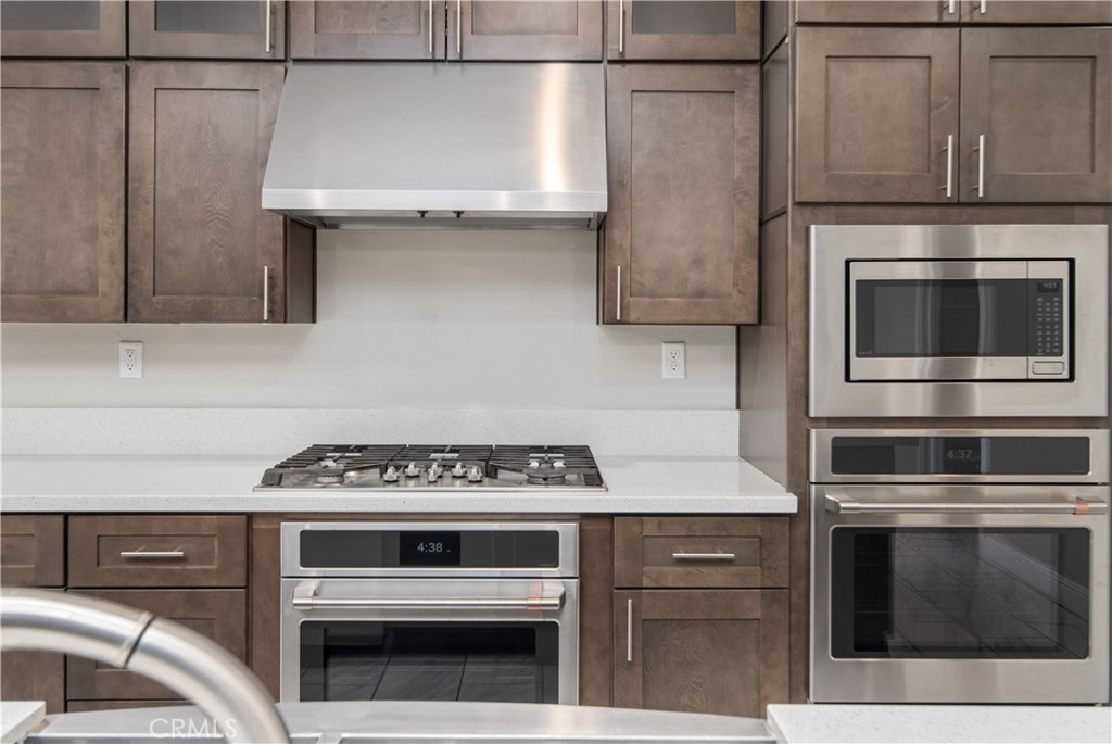 41908 Sonoma Road Palmdale, CA 93551 - Photo 17 of 75 a kitchen with granite countertop a stove and a microwave