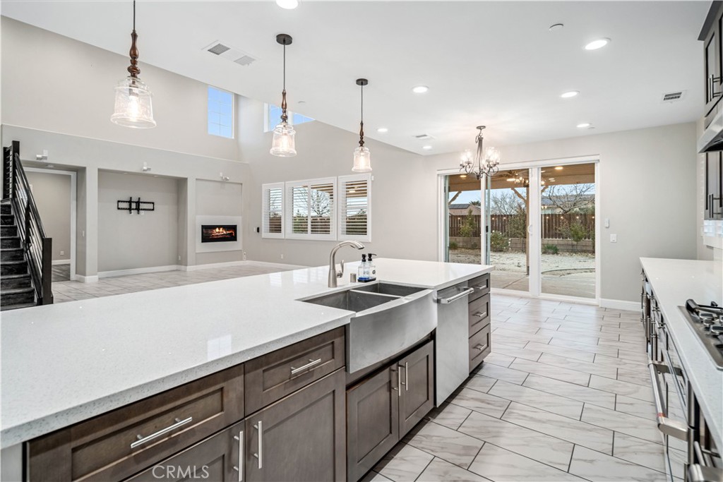 41908 Sonoma Road Palmdale, CA 93551 - Photo 18 of 75 a kitchen with stainless steel appliances granite countertop a sink and a stove