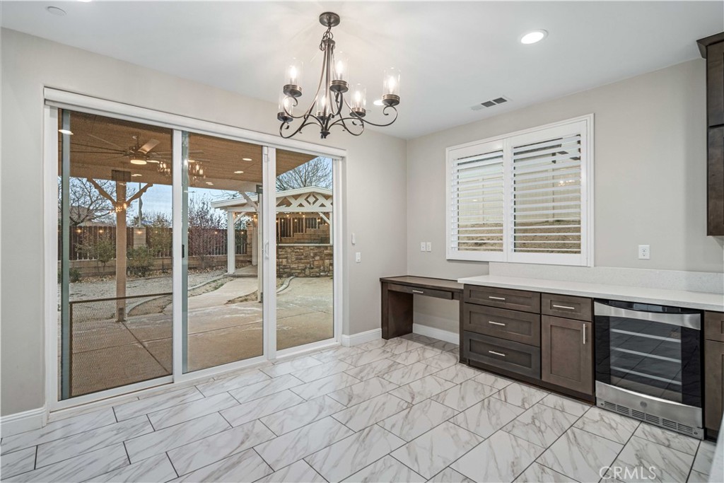 41908 Sonoma Road Palmdale, CA 93551 - Photo 19 of 75 a spacious bathroom with a granite countertop sink a large mirror and a bathtub
