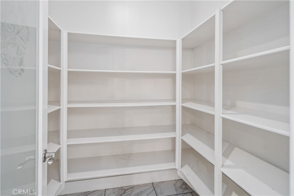 41908 Sonoma Road Palmdale, CA 93551 - Photo 21 of 75 a view of walk in closet with empty racks