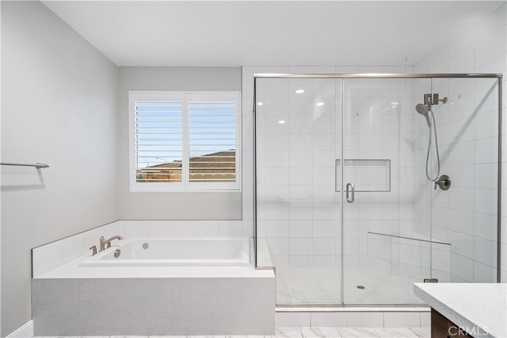41908 Sonoma Road Palmdale, CA 93551 - Photo 29 of 75 a bathroom with a bathtub and a shower