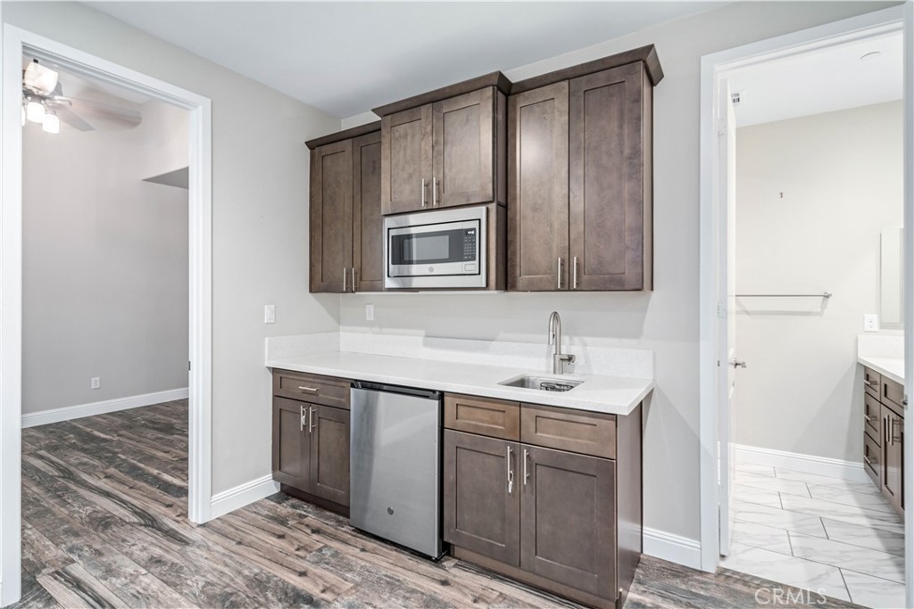 41908 Sonoma Road Palmdale, CA 93551 - Photo 36 of 75 a bathroom with a sink and a mirror
