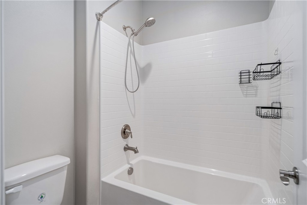 41908 Sonoma Road Palmdale, CA 93551 - Photo 38 of 75 a bathroom with a bath tub with a toilet