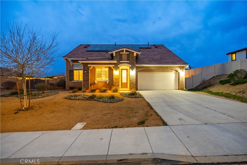 41908 Sonoma Road Palmdale, CA 93551 - Photo 4 of 75 a front view of a house with a yard