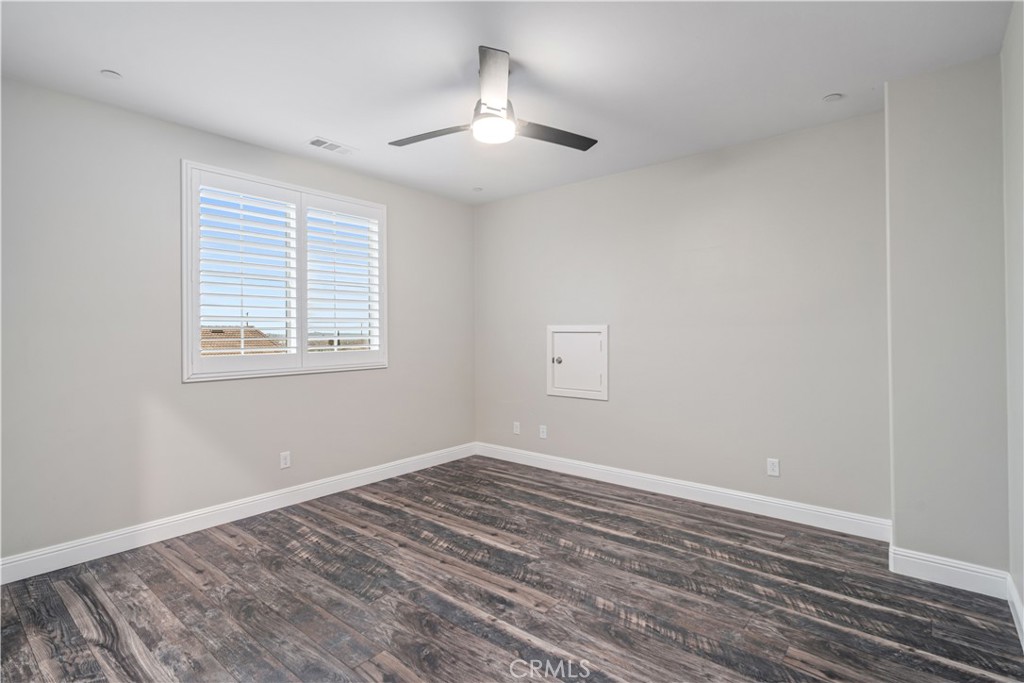 41908 Sonoma Road Palmdale, CA 93551 - Photo 45 of 75 a view of empty room with wooden floor and fan