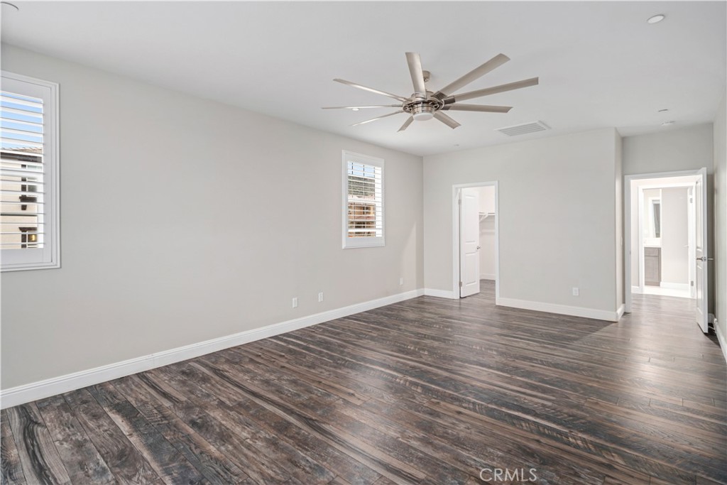 41908 Sonoma Road Palmdale, CA 93551 - Photo 48 of 75 a view of an empty room with wooden floor and a window