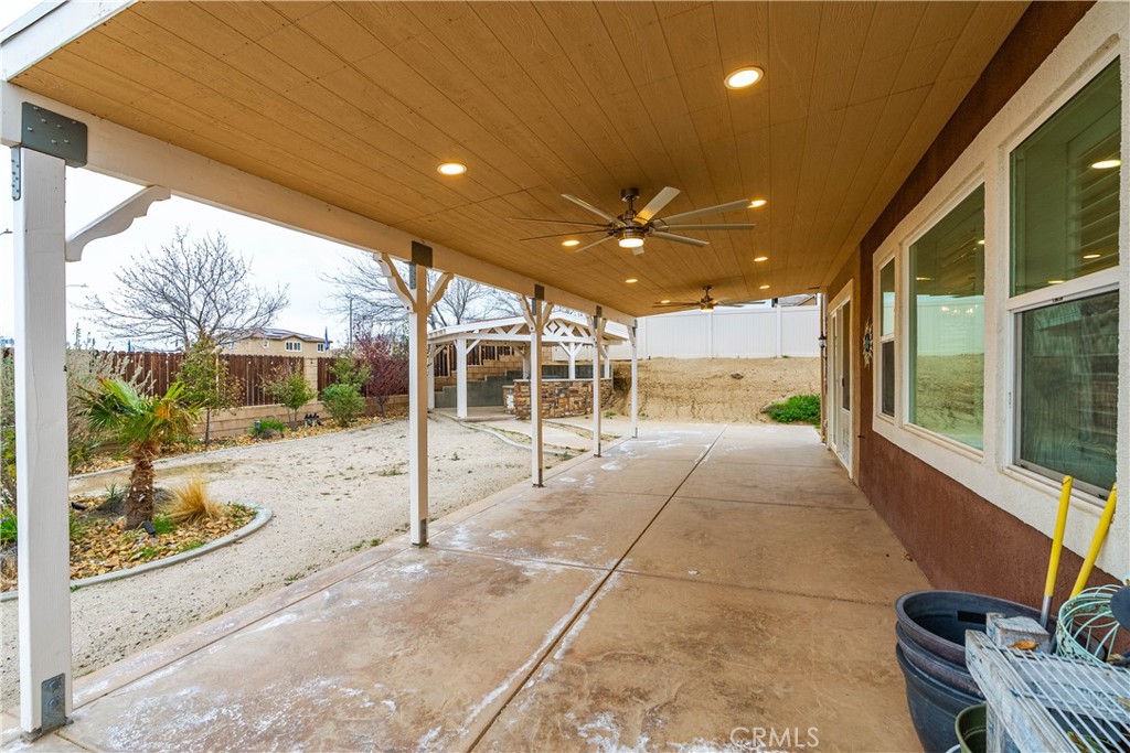 41908 Sonoma Road Palmdale, CA 93551 - Photo 52 of 75 a view of a porch with chairs and backyard