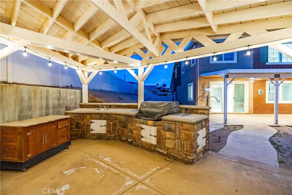 41908 Sonoma Road Palmdale, CA 93551 - Photo 57 of 75 a kitchen with stainless steel appliances granite countertop a stove a sink and a microwave