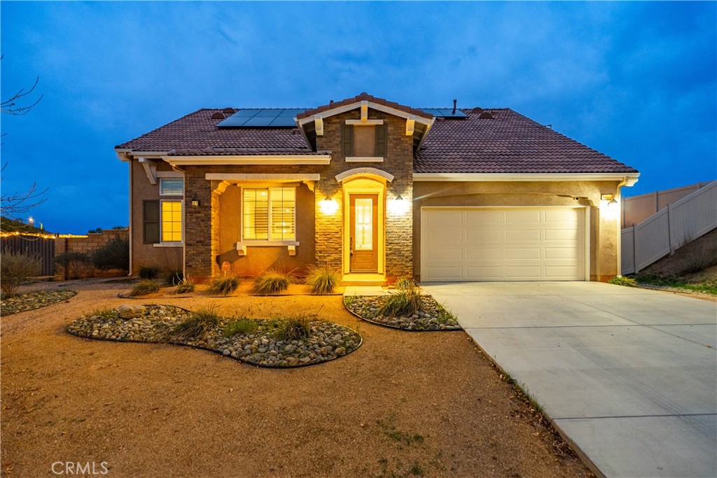 41908 Sonoma Road Palmdale, CA 93551 - Photo 6 of 75 a front view of a house with a yard