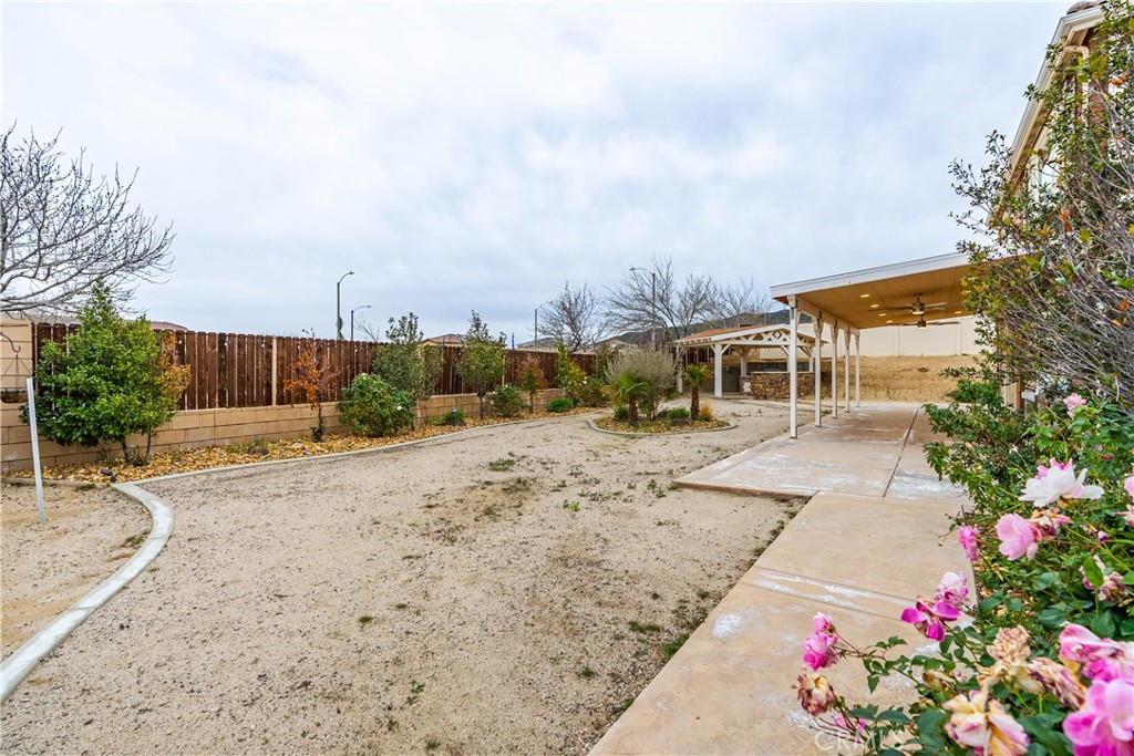 41908 Sonoma Road Palmdale, CA 93551 - Photo 63 of 75 a view of a yard with wooden fence