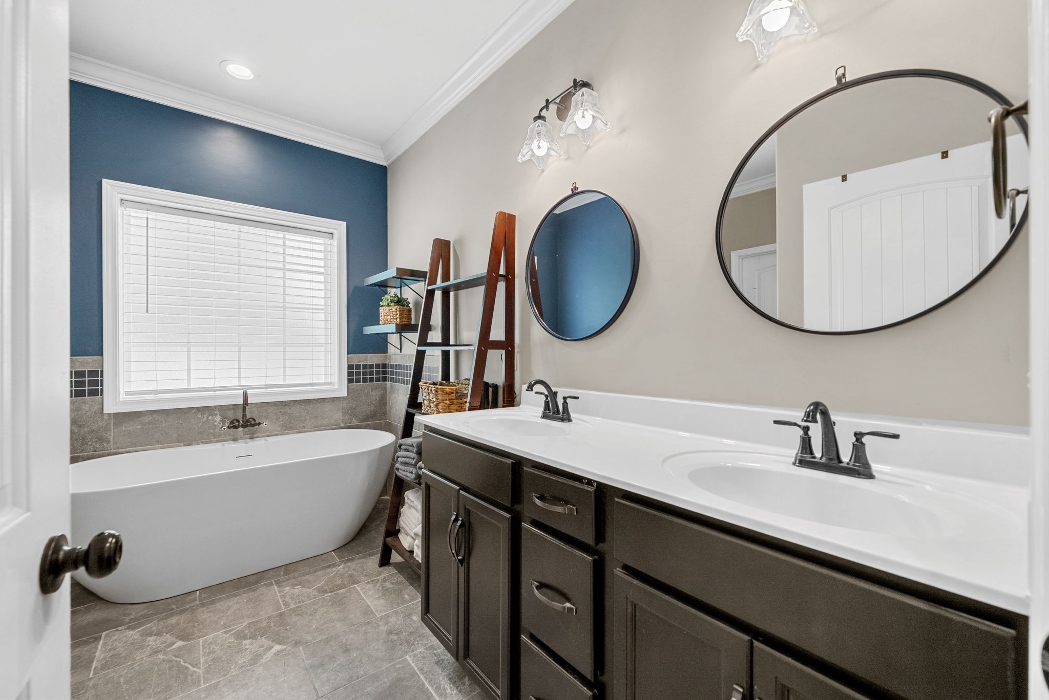 1663 Southside Road Southside, TN 37171 - Photo 22 of 59 a bathroom with a double vanity sink and a bathtub