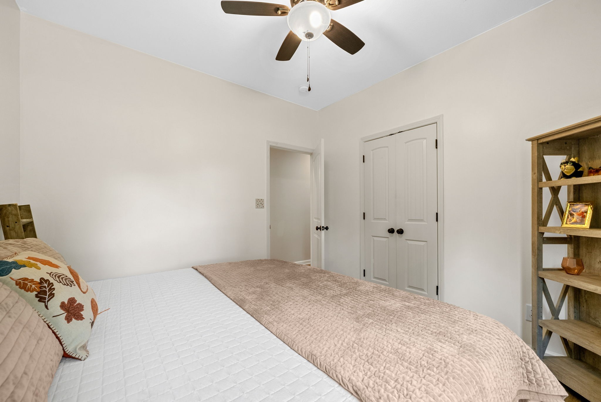 1663 Southside Road Southside, TN 37171 - Photo 29 of 59 a bedroom with a bed and a book shelf