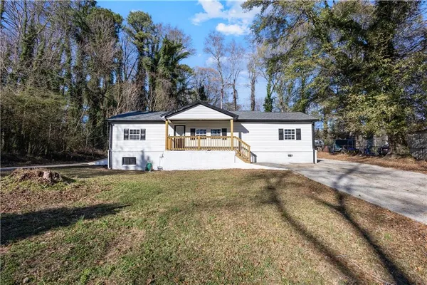 a house with trees in front of it