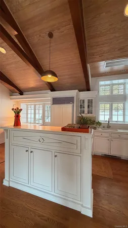 a kitchen with cabinets a sink and appliances