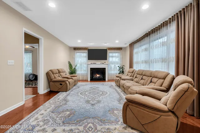 a living room with furniture window and a fireplace