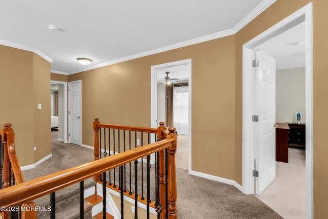 a view of hallway with wooden floor